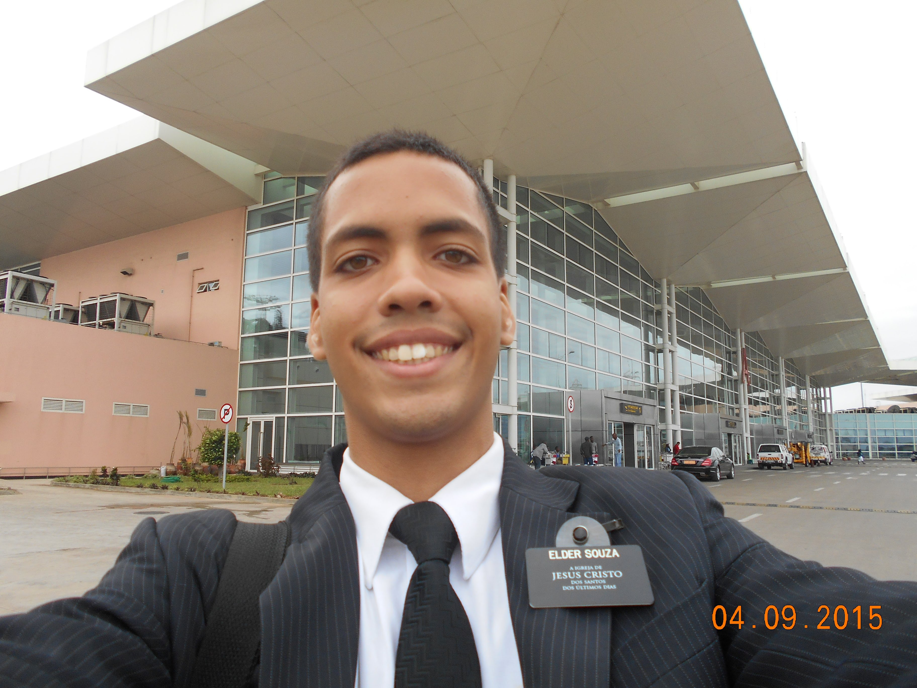 Myself in front of the Maputo Airport, with a suit and tie.